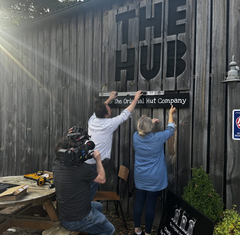updating signage at The Hub cafe